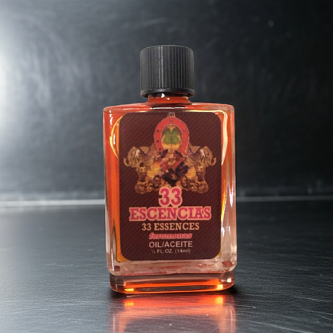 Bottle of 33 Essencias oil on a reflective surface with a dark background