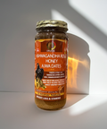 Jar of Ashwagandha Root Honey Ajwa Dates on a white background