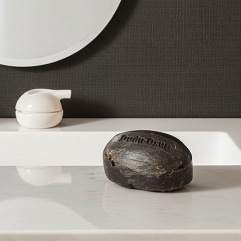 Dudu Osun black soap bar suitable for cleansing face and body.