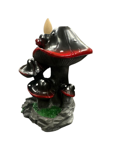Decorative mushroom-shaped incense burner with red accents on a white background