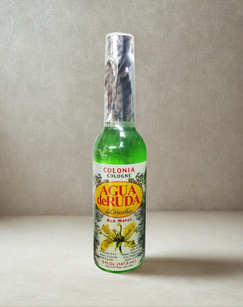 Spiritual water made with ruda displayed in a bottle for ritual and blessing use.