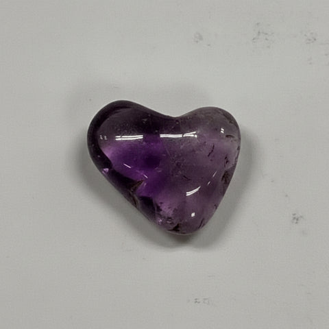 Amethyst tumbled stone from Brazil healing crystal pieces for meditation, emotional balance, and holistic energy work.