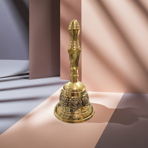 Brass bell featuring seven chakra symbols engraved around the body.