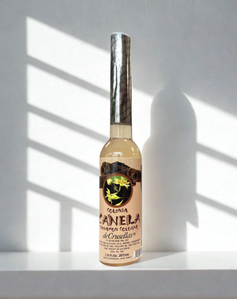 Cinnamon spiritual water cologne in a bottle used for prayer, cleansing, and ceremonial practices.