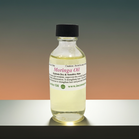Closeup view of cold pressed moringa carrier oil in a cosmetic bottle.