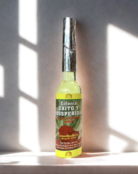Bottle of Colonia de Crusellas Exito y Prosperidad Spiritual Water for ritual use, blessings, and prosperity work.