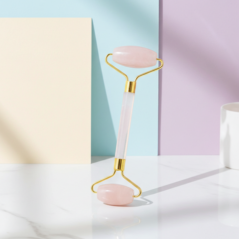 Double-ended face roller with large and small massage heads