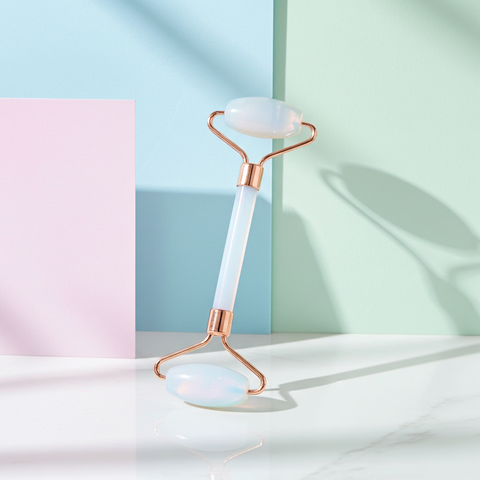 Facial roller for daily self-care and relaxing skincare routine.