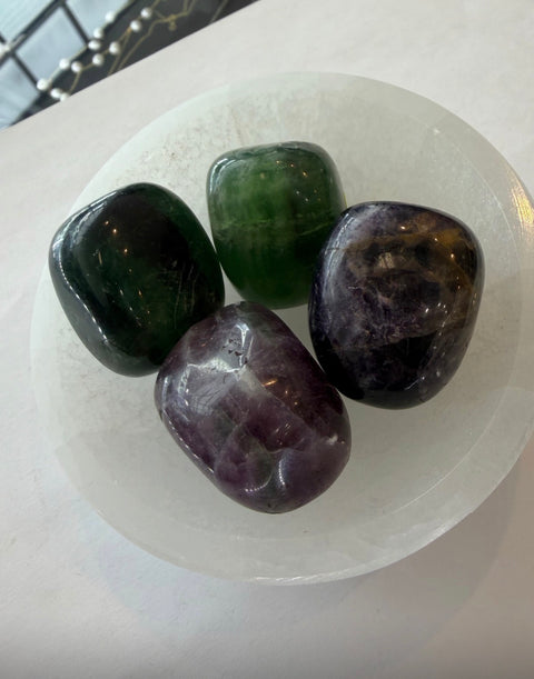 Rainbow Fluorite Tumbled Stones in selenite bowl — green and purple crystal for Heart and Third Eye Chakra.