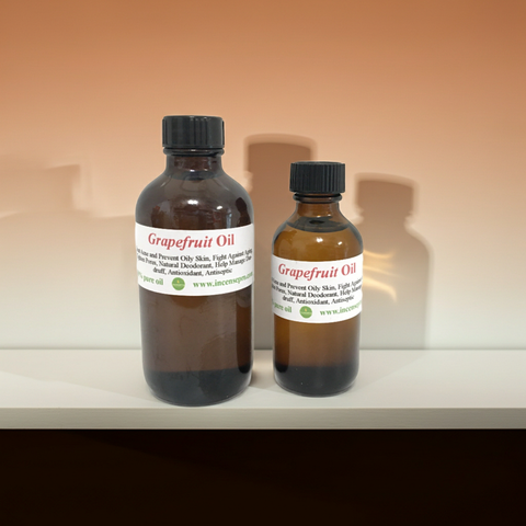 Natural grapefruit carrier oil in a clear bottle for skincare and massage use.