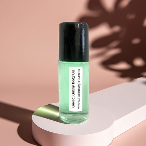 Guccci Guilty fragrance body oil bottle for moisturizing skin, scent layering, and personal care use.