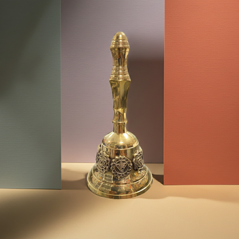 Handcrafted brass bell decorated with a seven chakra design.
