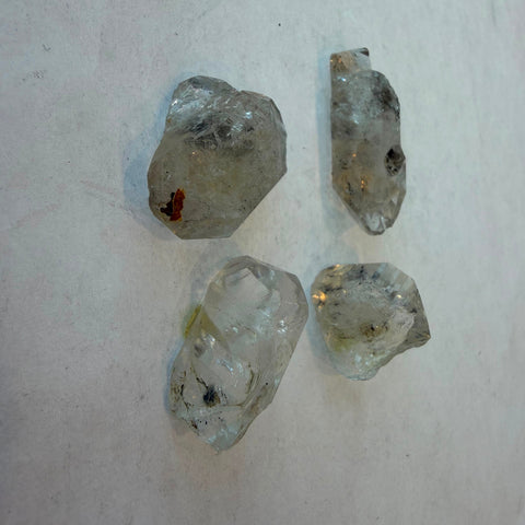 Clear Herkimer Diamond quartz crystal with natural facets and internal inclusions