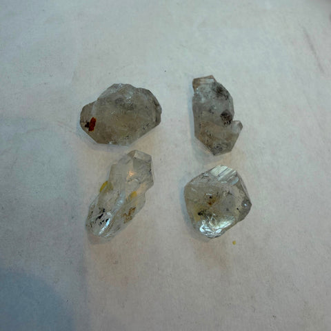 Group of natural Herkimer Diamond quartz crystals showing clarity and inclusions