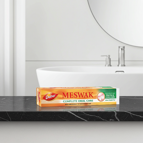 Meswak toothpaste tube for daily brushing, fresh breath, and natural oral care.