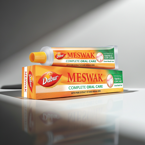 Meswak toothpaste tube for teeth cleaning, gum care, and regular oral hygiene use.