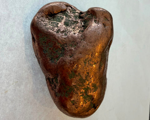 Native copper nugget showing warm metallic surface and natural oxidation