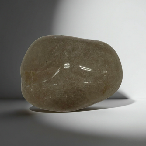 Natural Brazilian Rutilated Quartz tumbled stone for spiritual practice, manifestation, and crystal healing routines.