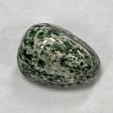 Natural Green Point tumbled crystal stone for reiki work, meditation, and energy cleansing rituals.