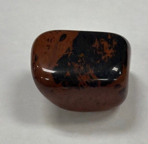 Natural Mahogany Obsidian tumbled crystal stone for grounding practice, chakra work, and everyday spiritual use.