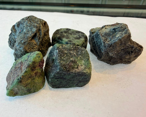 Natural Ruby in Zoisite stone showing ruby inclusions in green zoisite