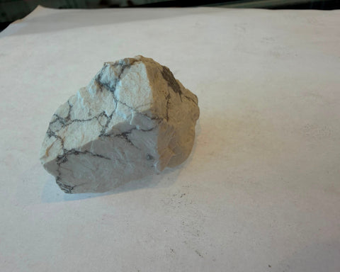 Natural undyed Howlite stone showing chalky white base and grey veins