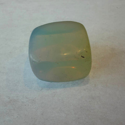 Group of opalite tumbled stones showing pale blue and peach glow