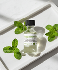 Pure peppermint essential oil in a bottle for aromatherapy
