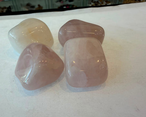 Tumbled Pink Calcite stone with smooth polished surface and soft pink coloring
