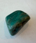 Polished amazonite tumbled stone in soft blue-green with white streaking