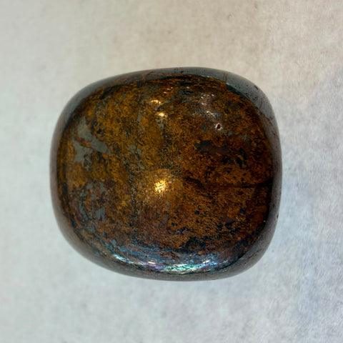 Polished Bronzite tumbled stones with natural bronze schiller variation