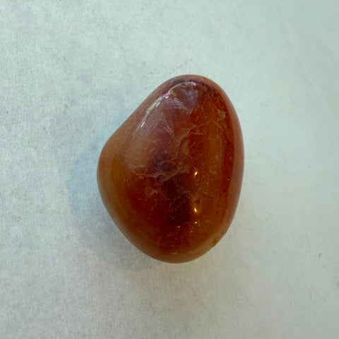 Carnelian stone showing warm amber-orange color and glossy polish