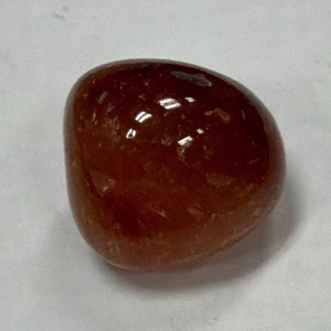 Polished Carnelian tumbled stone crystal for meditation, intention setting, and spiritual rituals.