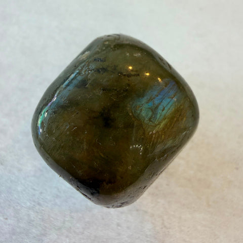 Bowl of polished Labradorite tumbled stones with grey and olive coloring