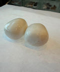 Two polished Milky Quartz stones with smooth translucent white surfaces