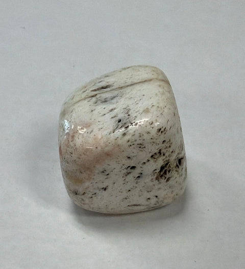 Polished Scolecite tumbled crystal stone for mindfulness, reiki sessions, and relaxation rituals.
