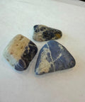 Polished sodalite stone showing blue and white marbled patterning