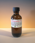 Bottle of pomegranate carrier oil for skincare and haircare use.