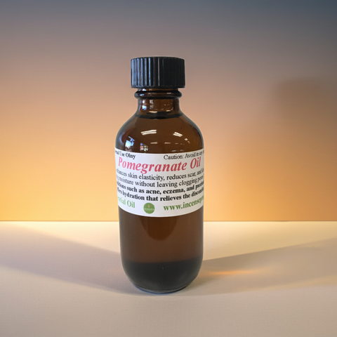 Bottle of pomegranate carrier oil for skincare and haircare use.