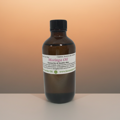 Pure moringa carrier oil in a glass dropper bottle on a clean background.
