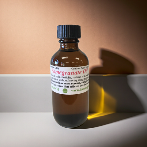 Pure pomegranate carrier oil in a clear cosmetic oil bottle.