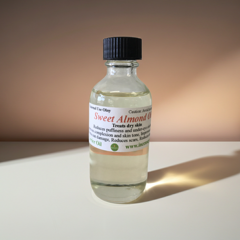 Close-up view of pure sweet almond carrier oil in a clear cosmetic bottle.