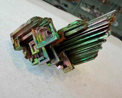 Rainbow bismuth crystal from above showing spiraling geometric terraces