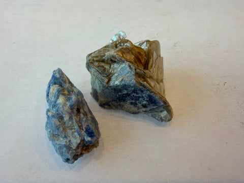 Raw Blue Kyanite specimen showing streaky blue coloring and layered blade surfaces