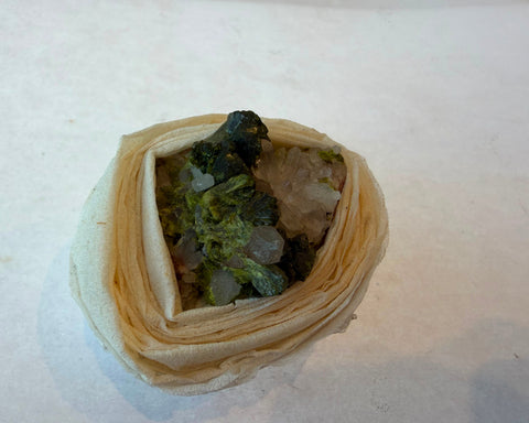Epidote crystal sprays with quartz points showing green and clear contrast