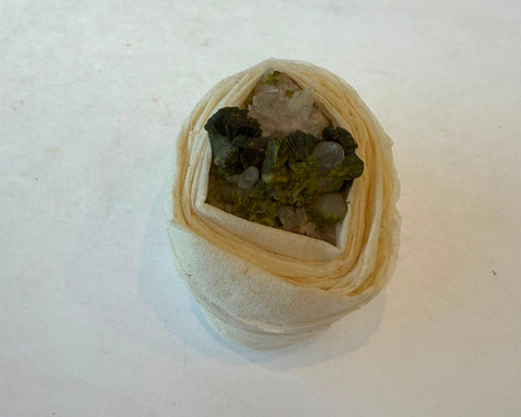 Natural epidote and quartz specimen with radiating green crystal blades