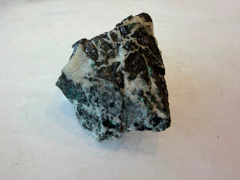 Galena mineral specimen showing dark metallic crystals set in white and grey matrix