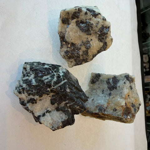 Raw Galena mineral specimen showing metallic luster and quartz matrix