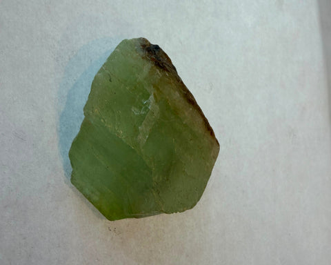 Three raw green fluorite pieces showing natural color and cleavage variation