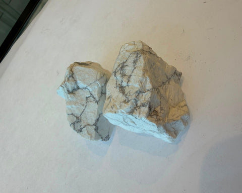 Raw Howlite crystal showing natural fracture surfaces and vein detail